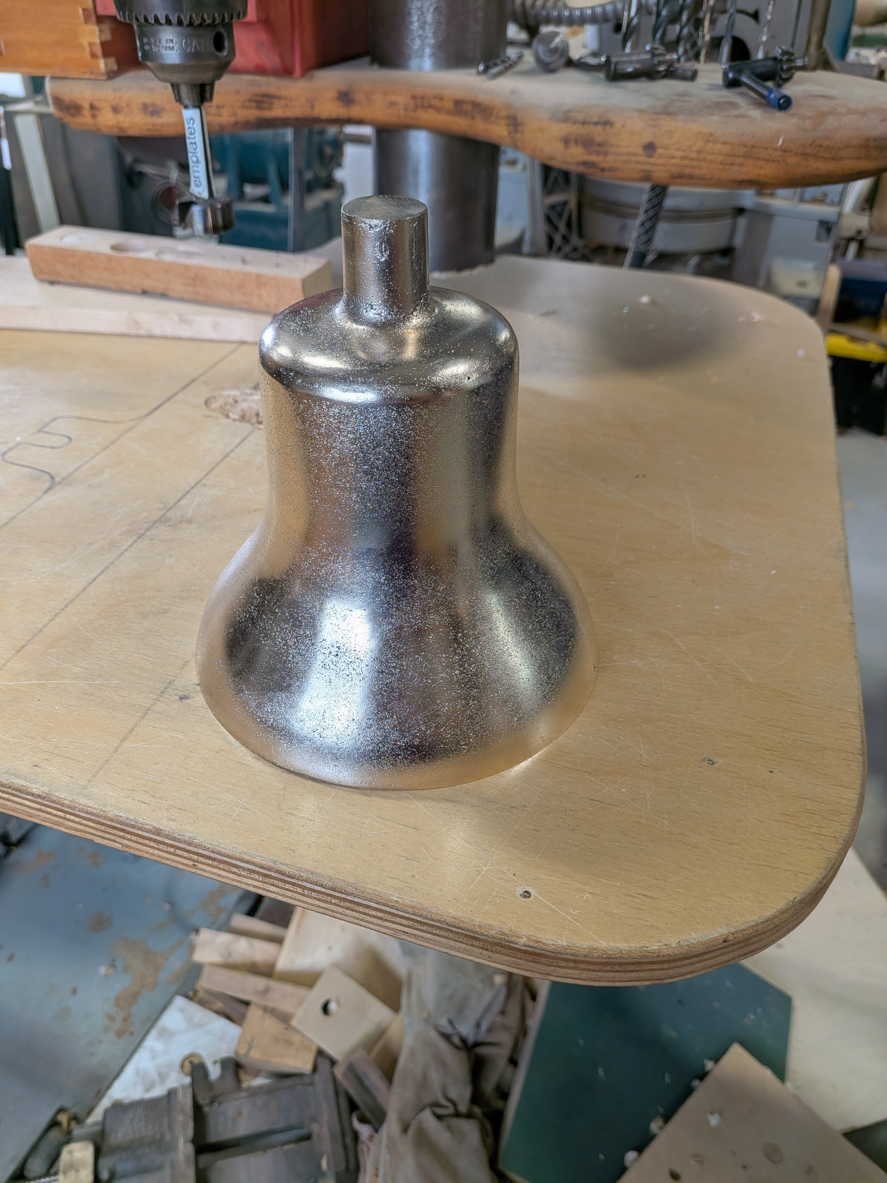 The polished bronze bell