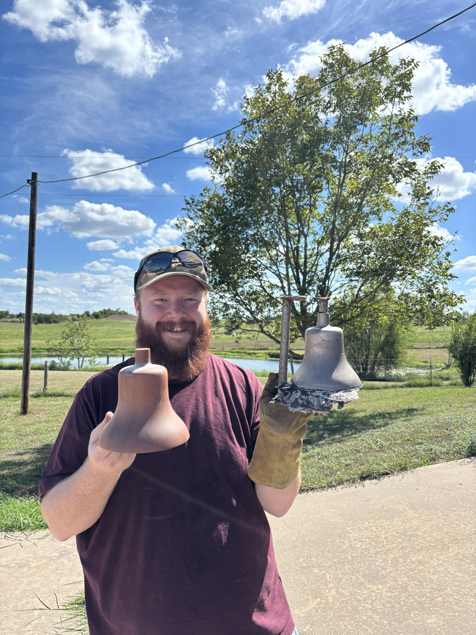 The raw bell casting along side the Mahogany Pattern